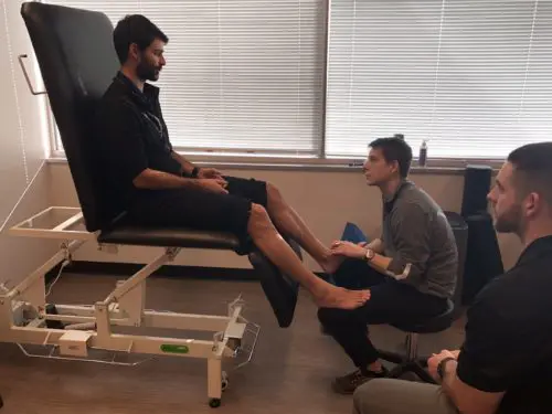 Alex working with Eric on sports physical therapy