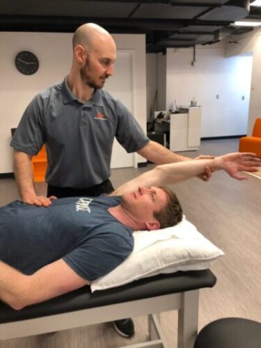 Zac with Andy as a patient - working on shoulder