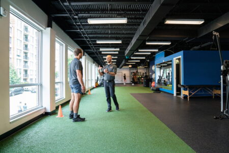 Zac explaining to Owen on turf